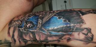 Część ręki z motywem Fantasy. Prace wykonał Robert studio Loch. 